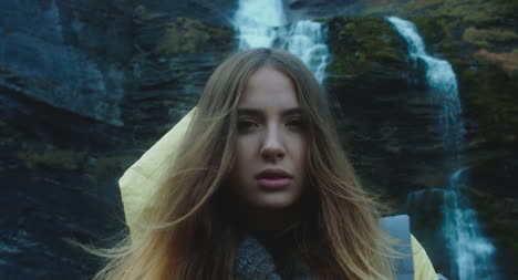 Young-Woman-In-Front-of-Waterfall