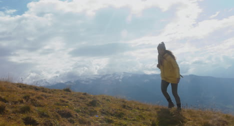 Woman-Hiking-in-Alpine-Meadow-01