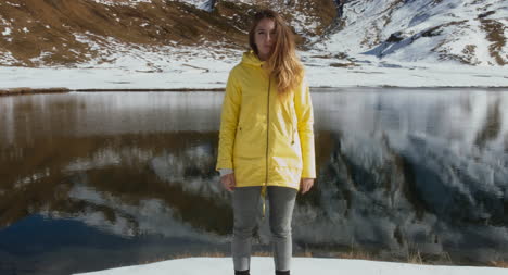 Woman-in-Front-of-Snowy-Lake-01