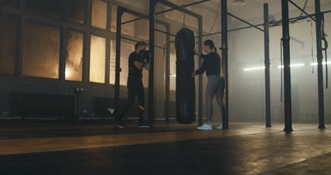Woman-Boxing-Bag-with-Trainer-01