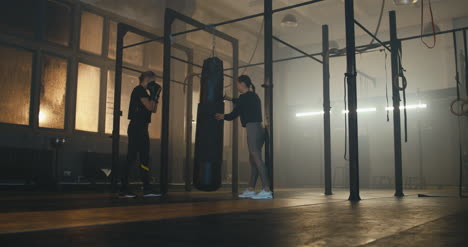 Woman-Boxing-Bag-with-Trainer-02