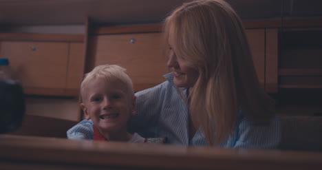 Mother-and-Son-in-Yacht-Cabin-01