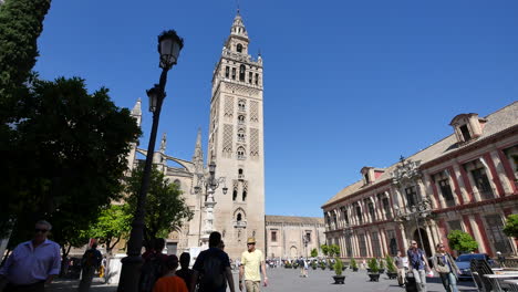 Seville-Giralda-Tower-With-Street-Light-And-Tourists