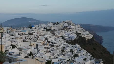 Greece-Santorini-Fira-In-Evening-With-Mountain