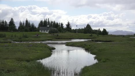 Iceland-Pingvellir-Oxara-River-And-Wooden-Buildings
