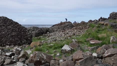 Northern-Ireland-Giants-Causeway-Shore-With-Man-On-Rock