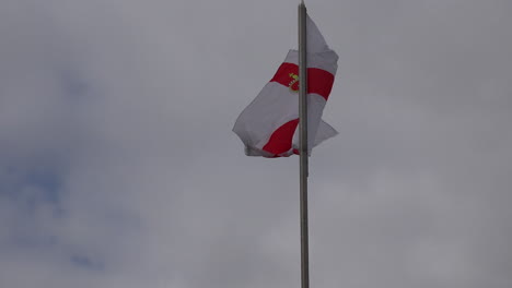 Northern-Ireland-Ulster-Flag-Against-Gray-Sky-
