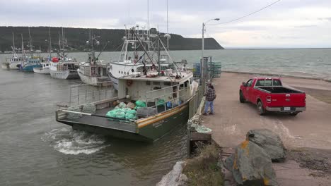 Canada-Nova-Scotia-New-Yarmouth-High-Tide-Tieing-Boat-To-Dock