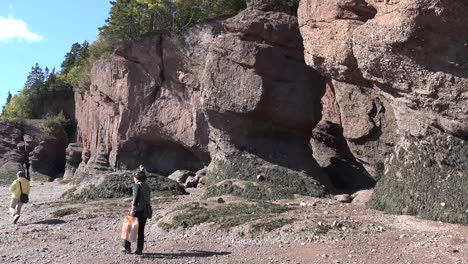 Canada-Tourists-Walk-By-Cliffs