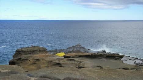 Oahu-Coast-With-Fishermen,-Tent-And-Waves