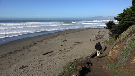 California-Man-Walking-Down-Path-Toward-Beach-Near-Salmon-Creek