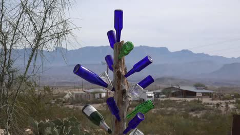 Texas-Terlingua-Bottles-Stuck-On-A-Pole