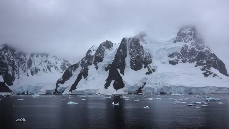 Antarctica-Lemaire-Rocks-Snow-And-Reflections