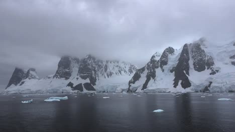 Antarctica-Lemaire-Zooms-In-On-Rocks-And-Snow-With-Ice