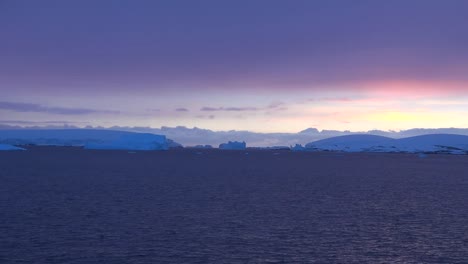 Antarctica-Zooms-On-Iceberg-At-Sunset