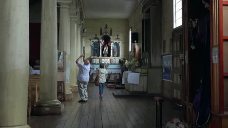 Chile-Chiloe-Chonchi-Tourists-Inside-Church-Zoom-In