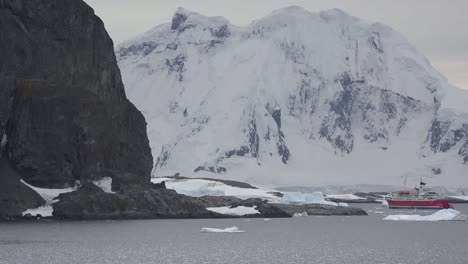 Antarctica-Expedition-Ship-And-White-Mountain