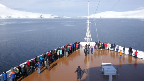 Antarctica-Passengers-On-Bow-Of-Ship