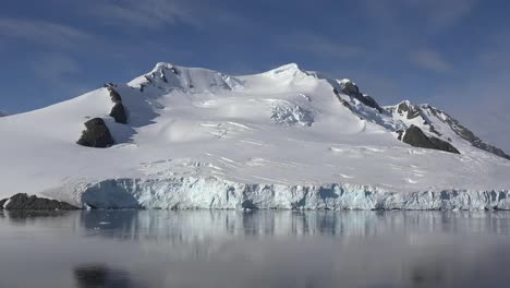 Antarctica-Snow-Clad-Peak-Under-Blue-Sky-Zoom-Out