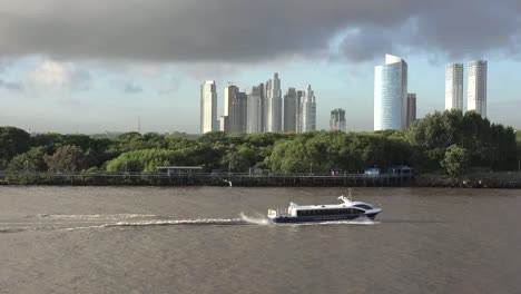 Argentina-Buenos-Aires-Boat-Passes-Skyscrapers