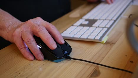 Old-Hand-Moves-From-Computer-Keyboard-To-Mouse
