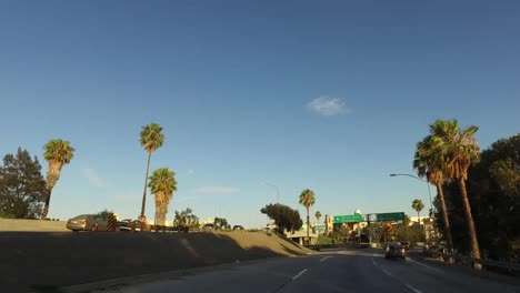 Los-Angeles-Driving-Past-Road-Signs