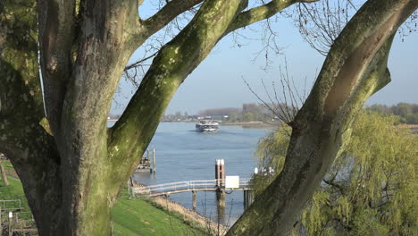 Netherlands-Cruise-Boat-Through-Trees-On-Der-Lek-Zoom-In