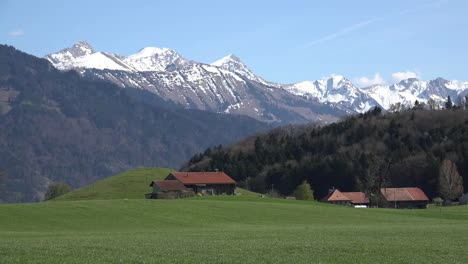 Switzerland-La-Gruyere-Mountains-Beyond-Meadow