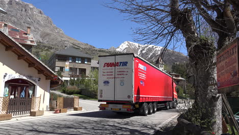 France-Meyronnes-Red-Truck-Drives-Through-Town