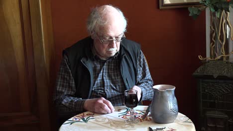 France-Old-Man-With-Glass-Of-Wine-Counting-Money