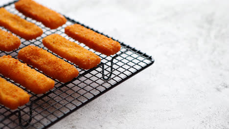 Rows-of-golden-fried-fresh-fish-fingers-fillets