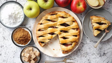 Delicious-apple-pie-cake-with-a-fresh-fruits--brown-and-powder-sugar