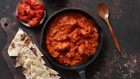 Traditional-Indian-chicken-tikka-masala-spicy-curry-meat-food-in-cast-iron-pan