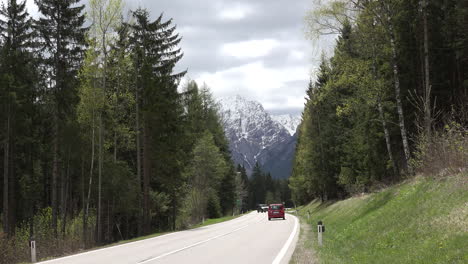 Austria-traffic-on-road-below-Dolomite-peak
