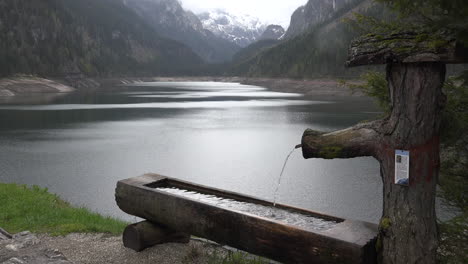 Austria-water-pours-into-wooden-basin