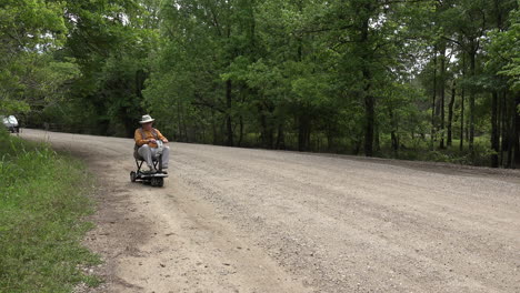 Louisiana-man-and-scooter-on-gravel-road