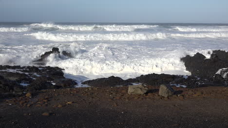 Oregon-big-wave-breaking-on-rock-by-dark-coast