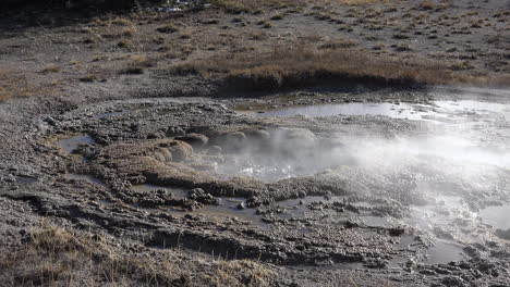 Yellowstone-boiling-hot-spring-with-steam