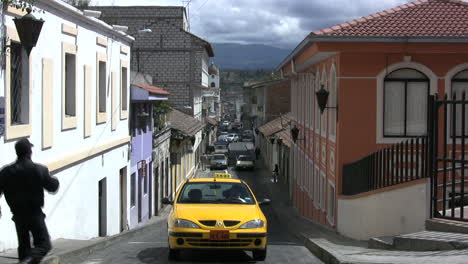 A-taxi-drives-up-a-street-in-Ecuador