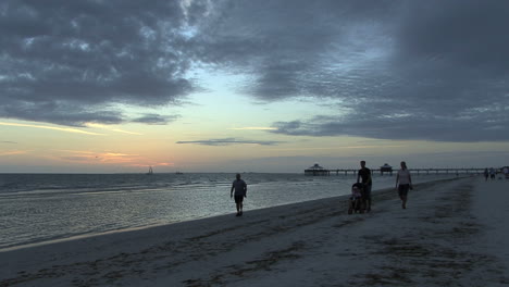 Florida-People-walking-on-beach-at-sunset