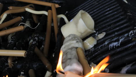 Fatima-wax-votive-offerings-and-flames