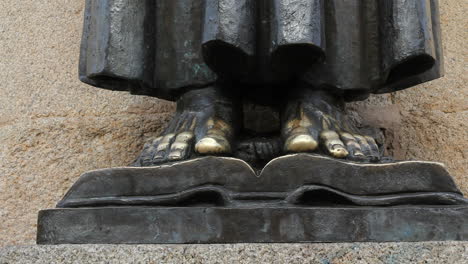 Spain-Extremadura-Caceres-feet-of-saint-statue