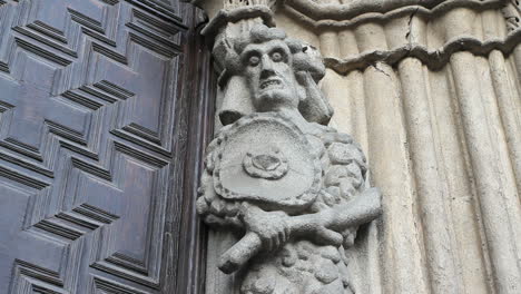 Spain-Castile-Avila-gruesome-statue-at-cathedral-door