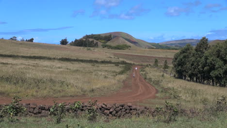 Easter-Island-Ahu-Akivi-hikers-on-red-dirt-road-1