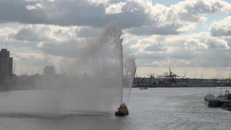 Netherlands-Rotterdam-geyser-and-mist-from-fireboat-on-Maas
