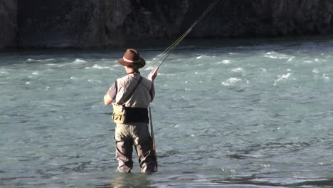 Canada-Alberta-Banff-Bow-River-fisherman-casts-into-rapids-8