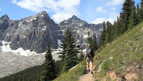 Canada-Alberta-Banff-Eiffel-Lake-Trail-hiker-stops-to-observe-cliffs-19