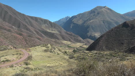 Peru-Sacred-Valley-dirt-road-curves-down-rugged-valley-11