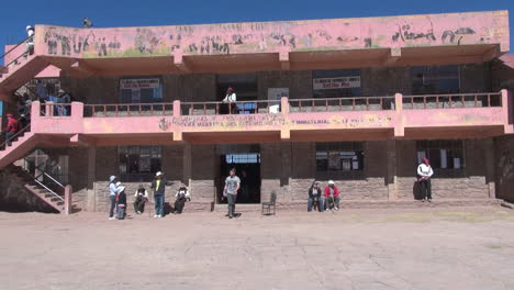 Peru-Taquile-people-on-steps-and-stairs-of-cooperative-building-9