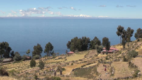 Peru-Taquile-lakeside-houses-terraces-and-stone-arch-11